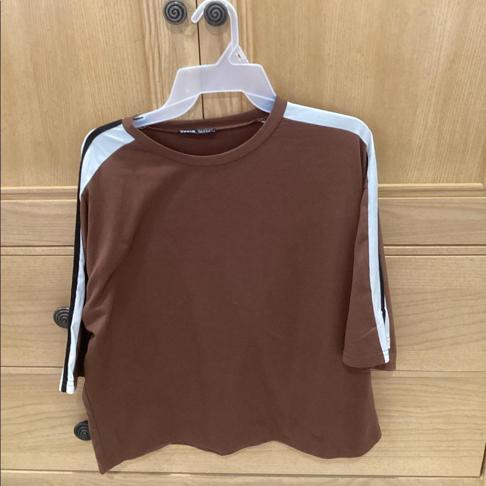 Brown shirt with white and black